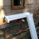 Chicken Coop Heater (shop light with cover off) - Exterior Pipe Protection (mounted under stairs and above wrapped pipe)