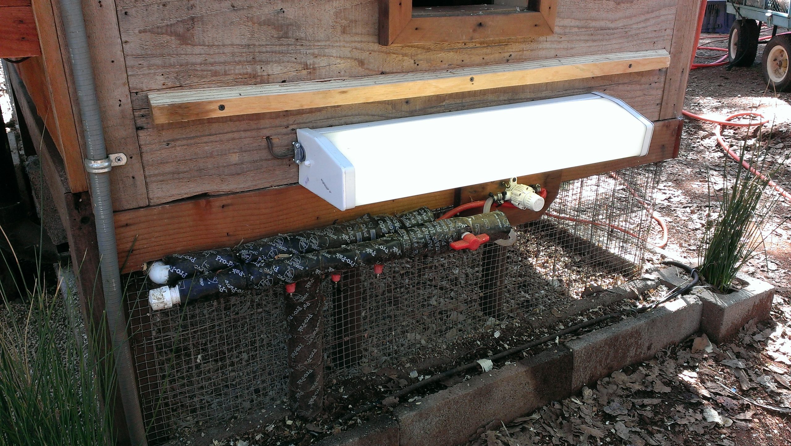Chicken Coop Heater - Exterior Pipe Protection (mounted under stairs and above wrapped pipe)